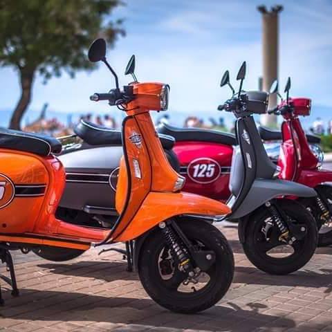 a red motorcycle parked in a parking lot