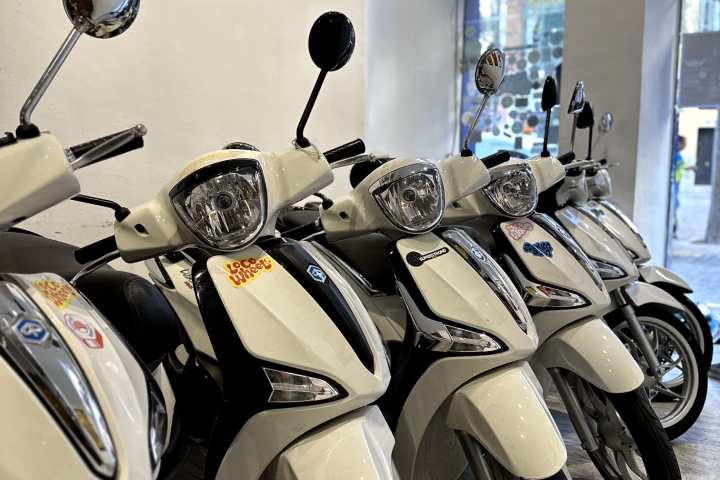 a row of parked motorcycles sitting on top of a motorcycle