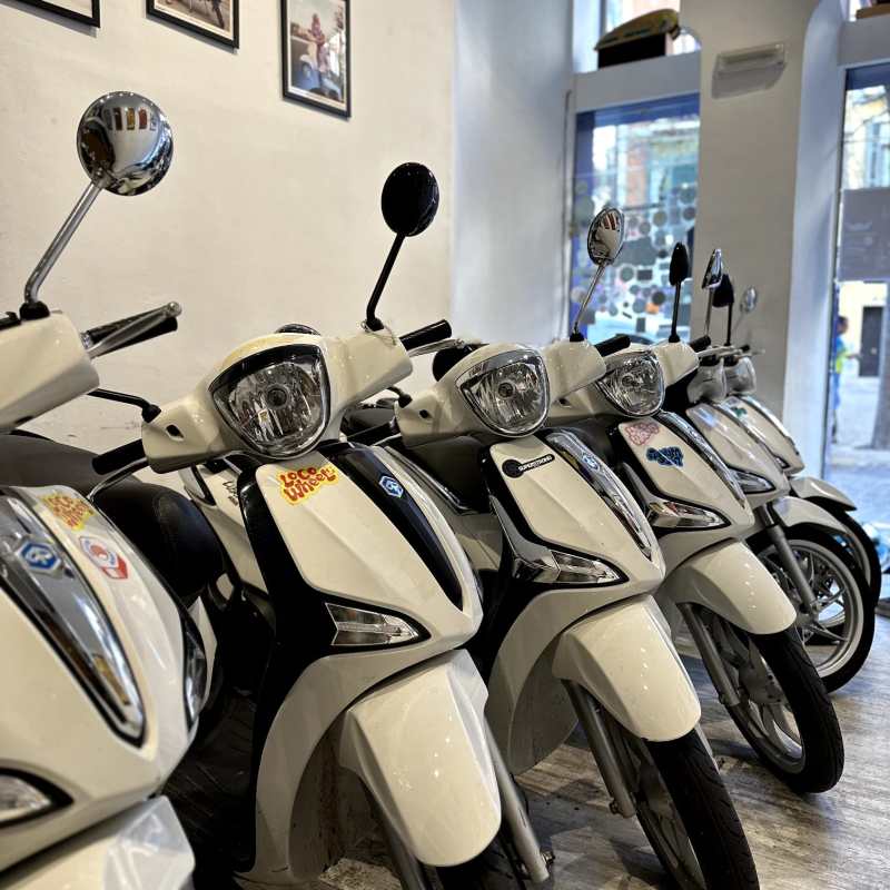a row of parked motorcycles sitting on top of a motorcycle