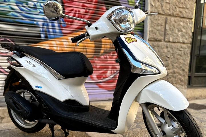 a motorcycle parked on the side of a building