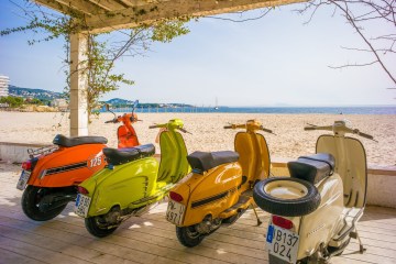 a motorcycle is parked on the beach